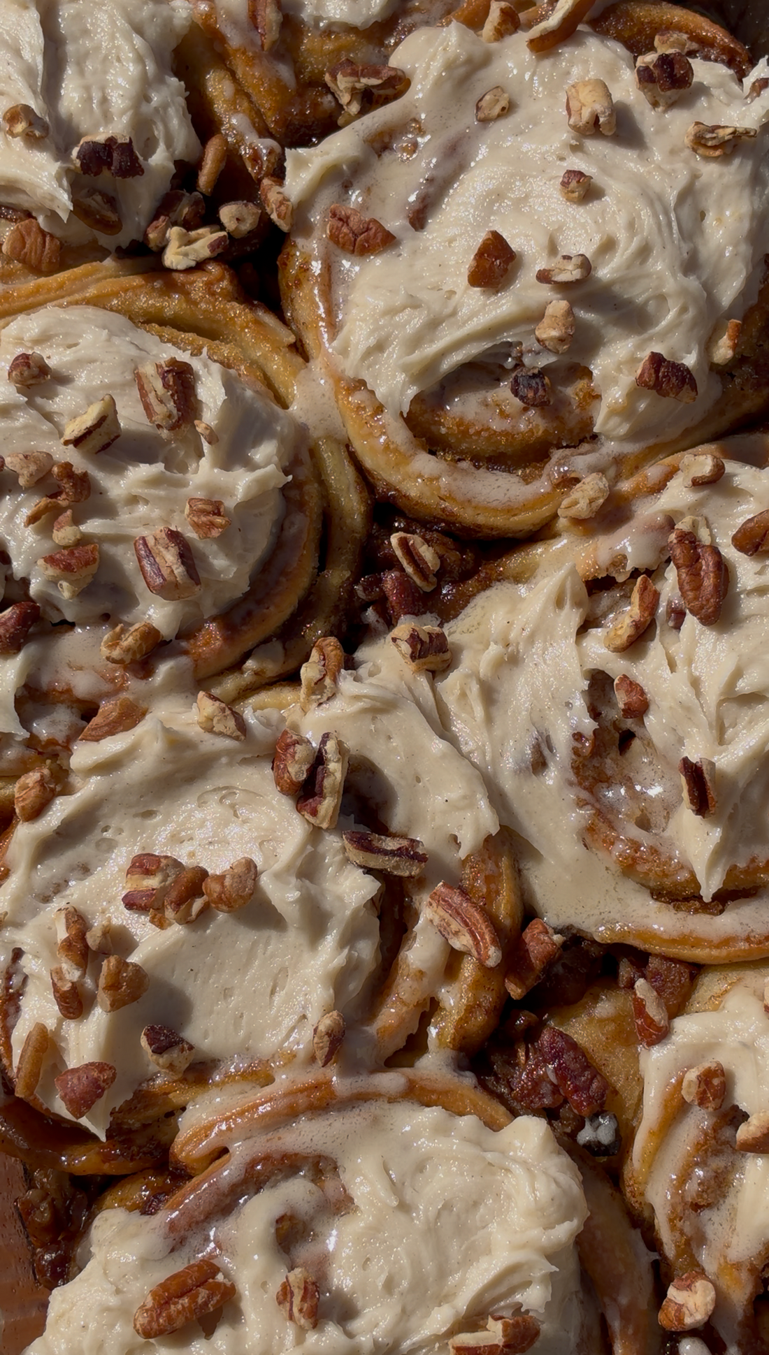 Gooey Bottom Pecan Pie Cinnamon Rolls with Velvet Vanilla Icing